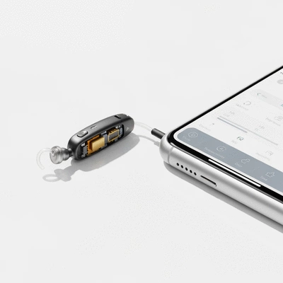 Modern Bluetooth hearing aid seamlessly connected to a smartphone, displaying an app for managing settings, clean background